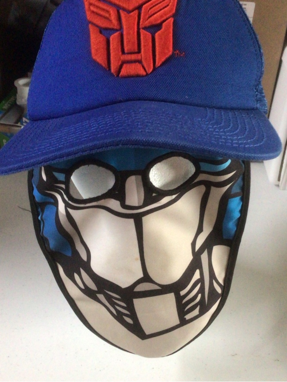 Blue Trucker Hat with Orange Autobot Emblem and Graphic Face Cover